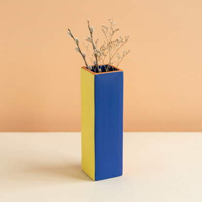 Primary Frame vase styled with fine dried branches