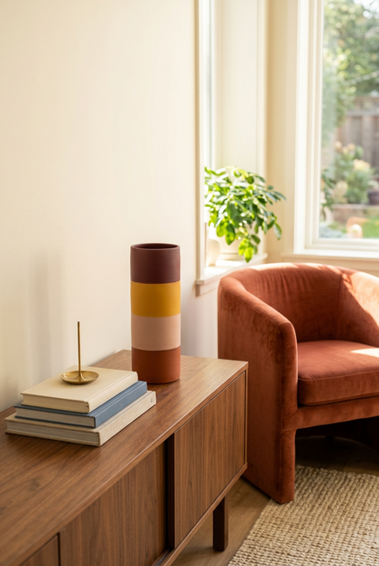 Color-block cylindrical vase on living room console