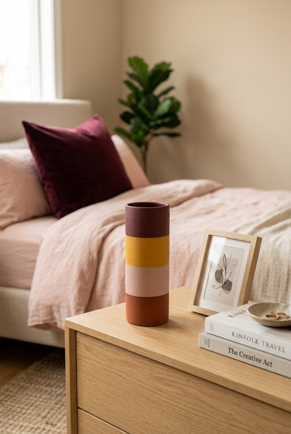 Warm color-block vase on bedroom dresser